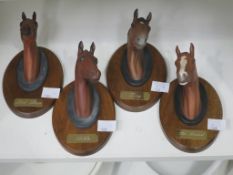 A Set of Four Beswick Mounted Race Horse Heads to include:- Red Rum, Arkle, The Minstral and Troy (