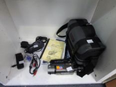 A Shelf containing a Sony HI8, 72X Digital Zoom Video Camera Recorder complete with AC Power