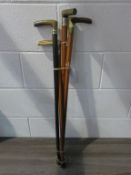 Four assorted Walking Sticks: one with silver joint, another with a joint (silver coloured)