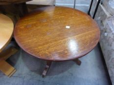 * A circular oak pedestal low Table, a taller pedestal Table, a Lamp Standard, a Bed Table and a
