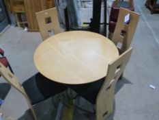 * A Round Lightwood Table with Four Chairs (5) (est £30-£60)