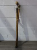 Three assorted Wooden Walking Sticks: one with silver joint (est £15-£25)