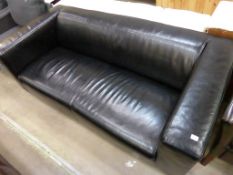 * A Black Faux Leather Three Seater Settee (est £20-£40)