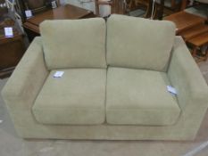 * A Green Suede Two Seater Sofa (est £50-£100)