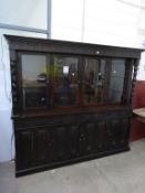 A very large Display Cabinet above Cupboard Unit. The Display Unit (fitted with lights) has a number