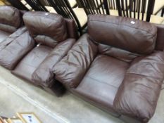 * A Brown Leather Deep Easy Three Piece Suite: Three Seat Settee and Two Armchairs all with broad