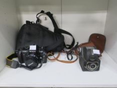 A Nikon F-501 AF Camera Body with an AF Nikkor 50mm 1:1.8 Lens and Soft Body Store, together with an