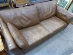 * A large plain brown leather three seat Settee with loose back and side cushions (est. £40-£80)