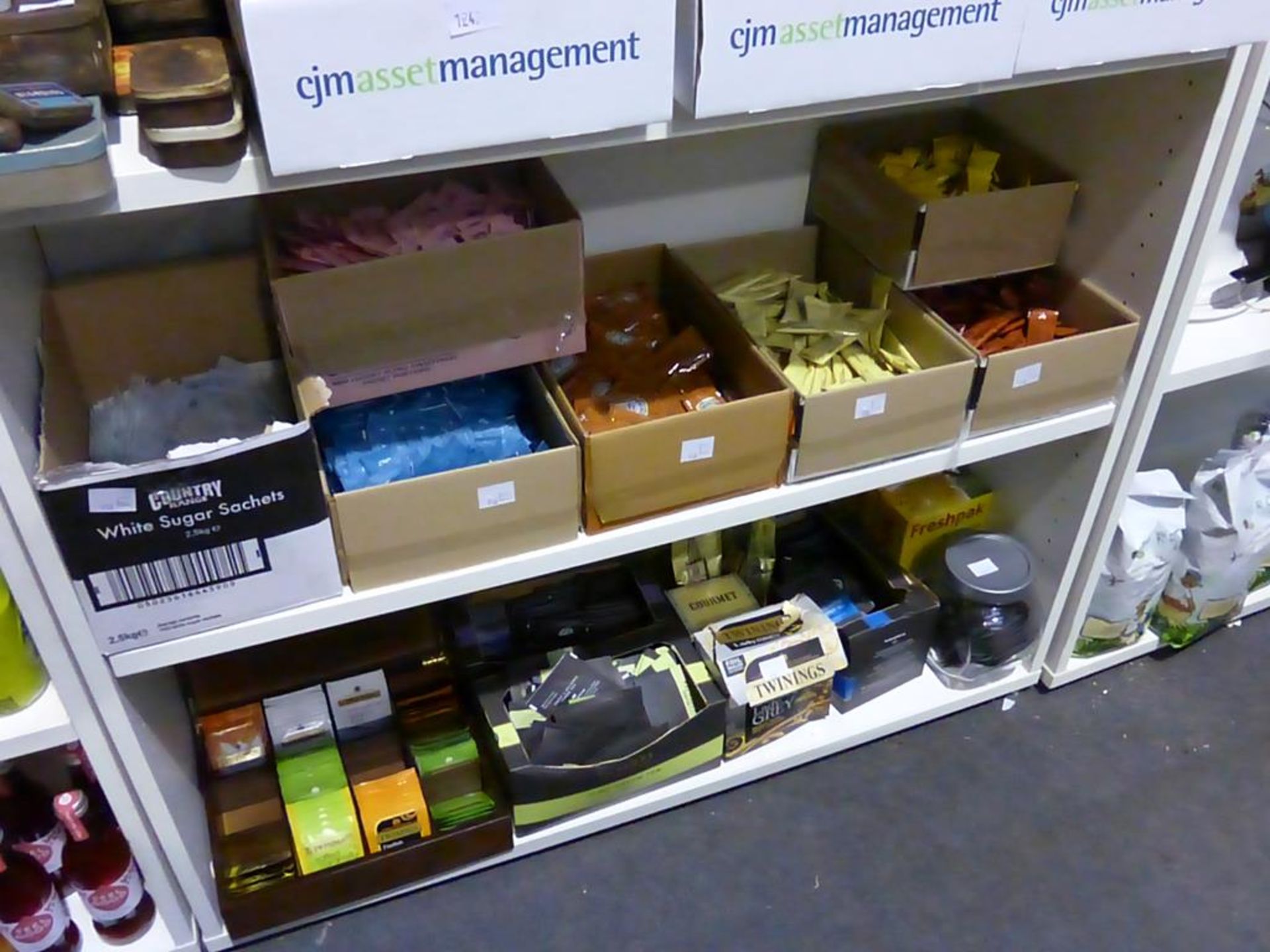 * Three shelves of food related items: Twinings Flavoured Tea in bespoke wooden box and others,