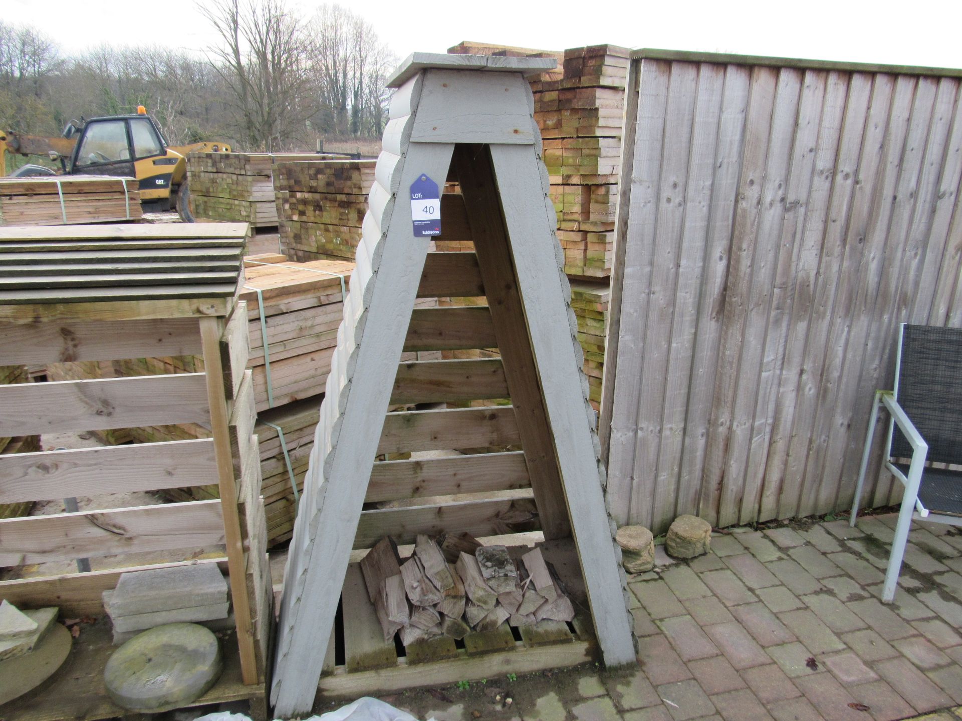 Painted timber log store