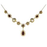 An antique pearl and garnet necklace in high carat yellow gold designed as alternating pearls and