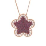 A ruby and diamond pendant and chain 18ct yellow gold designed as a five petal flower set with a