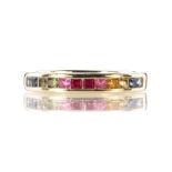 A rainbow sapphire half eternity ring in 18ct white gold set with twelve princess cut sapphires of