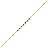 A sapphire and diamond line bracelet in 18ct yellow gold, set with alternating round cut blue
