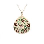 An enamel and silver teardrop pendant and chain designed as a teardrop shape with floral enamel