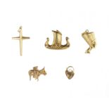 Five antique / vintage gold charms four in 9ct yellow gold designed as a crucifix, a heart padlock