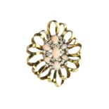 An antique 1940s opal and diamond brooch / pendant in high carat yellow gold and platinum designed