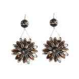 A pair of antique 19th Century tortoiseshell earrings each designed as a flower with three layers of