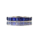 CARTIER - A sapphire eternity ring by Cartier in 18ct white gold set with twenty two princess cut