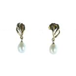 A pair of antique pearl earrings in 9ct yellow gold each designed as a single pearl suspended from a