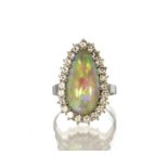 An opal and diamond cluster dress ring in 18ct white gold designed as an elongated tear drop shape