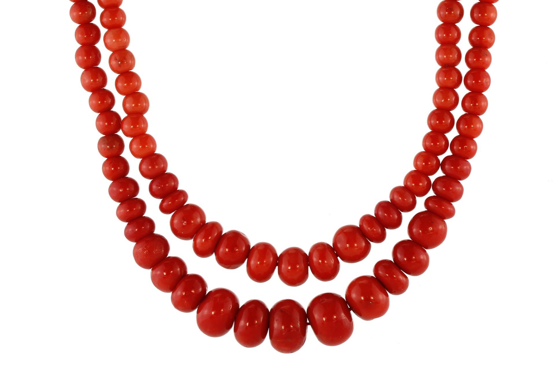 A fine Italian coral bead necklace in 18ct yellow gold designed as two strands of graduated round