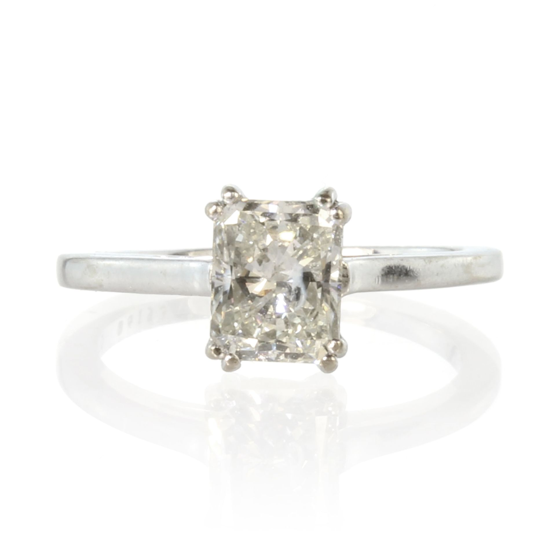 A 1.01ct solitaire diamond engagement ring in 18ct white gold set with a radiant cut diamond of 1.