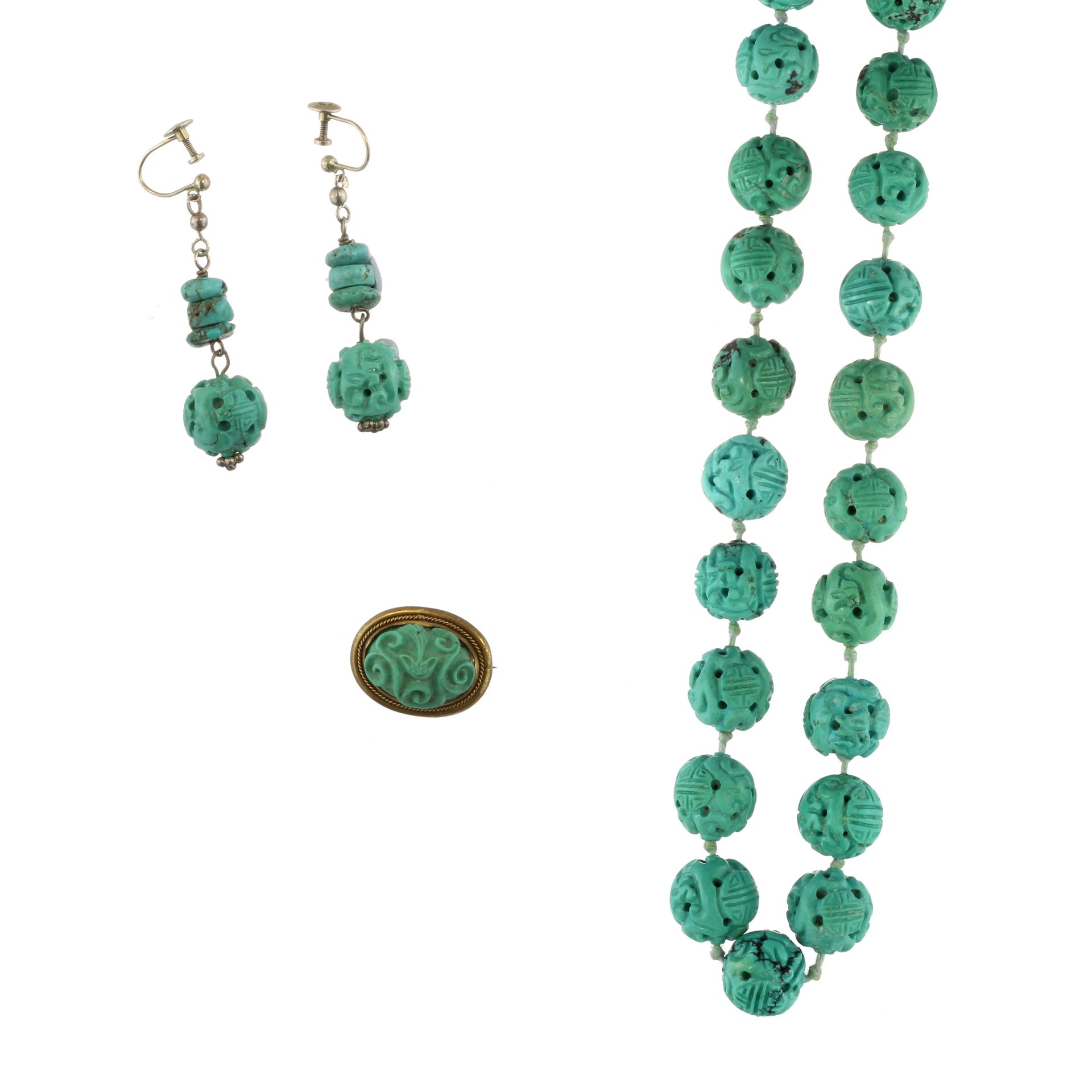 A carved turquoise necklace, earrings and brooch suite the necklace formed as a single strand of