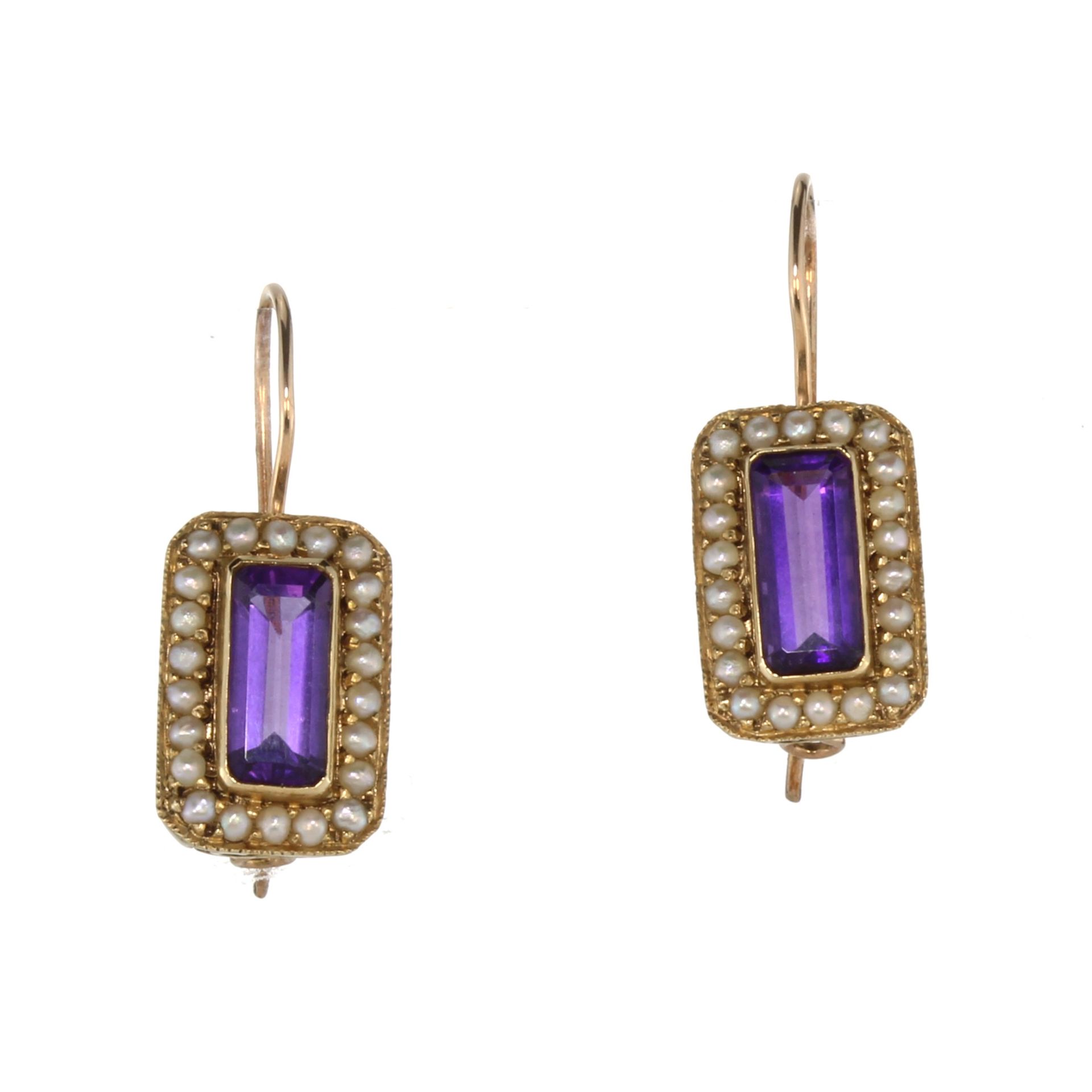 A pair of amethyst and seed pearl cluster earrings in yellow gold each set with an octagonal step