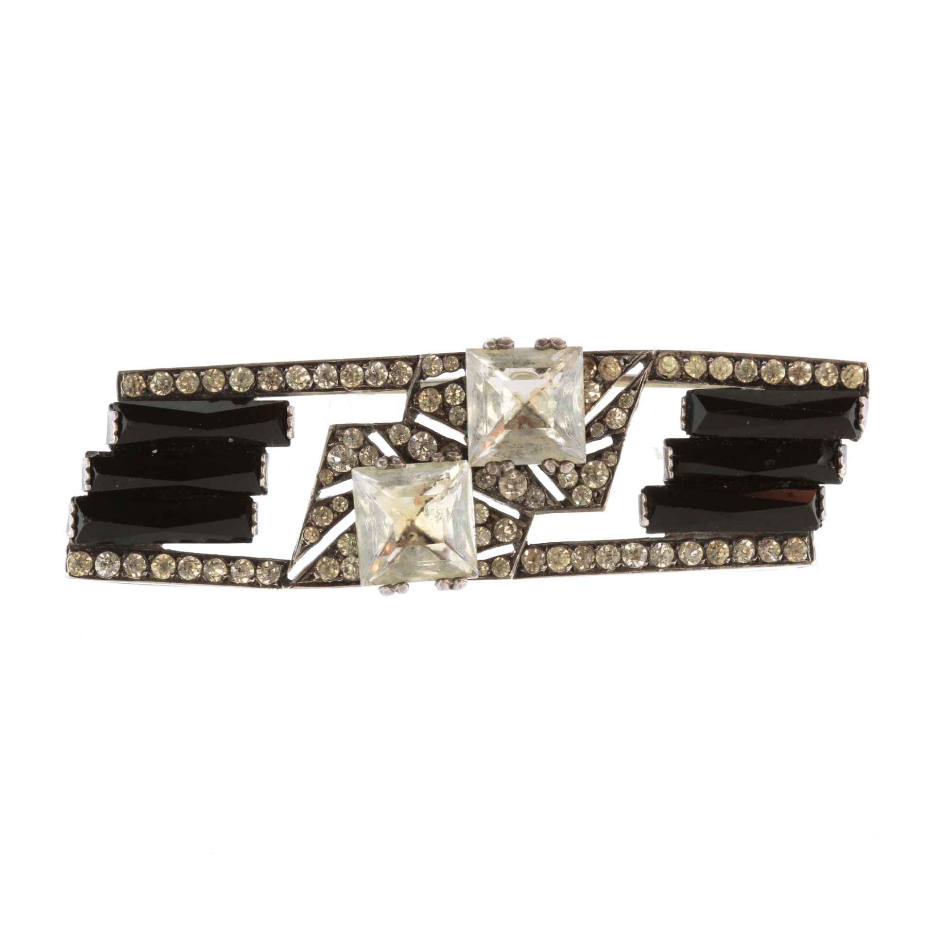 An antique French Art Deco onyx and paste brooch in silver of rectangular form set with faceted