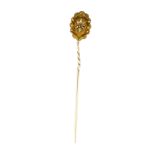 An antique diamond stick / tie pin in 18ct yellow gold designed as a rose cut diamond within a