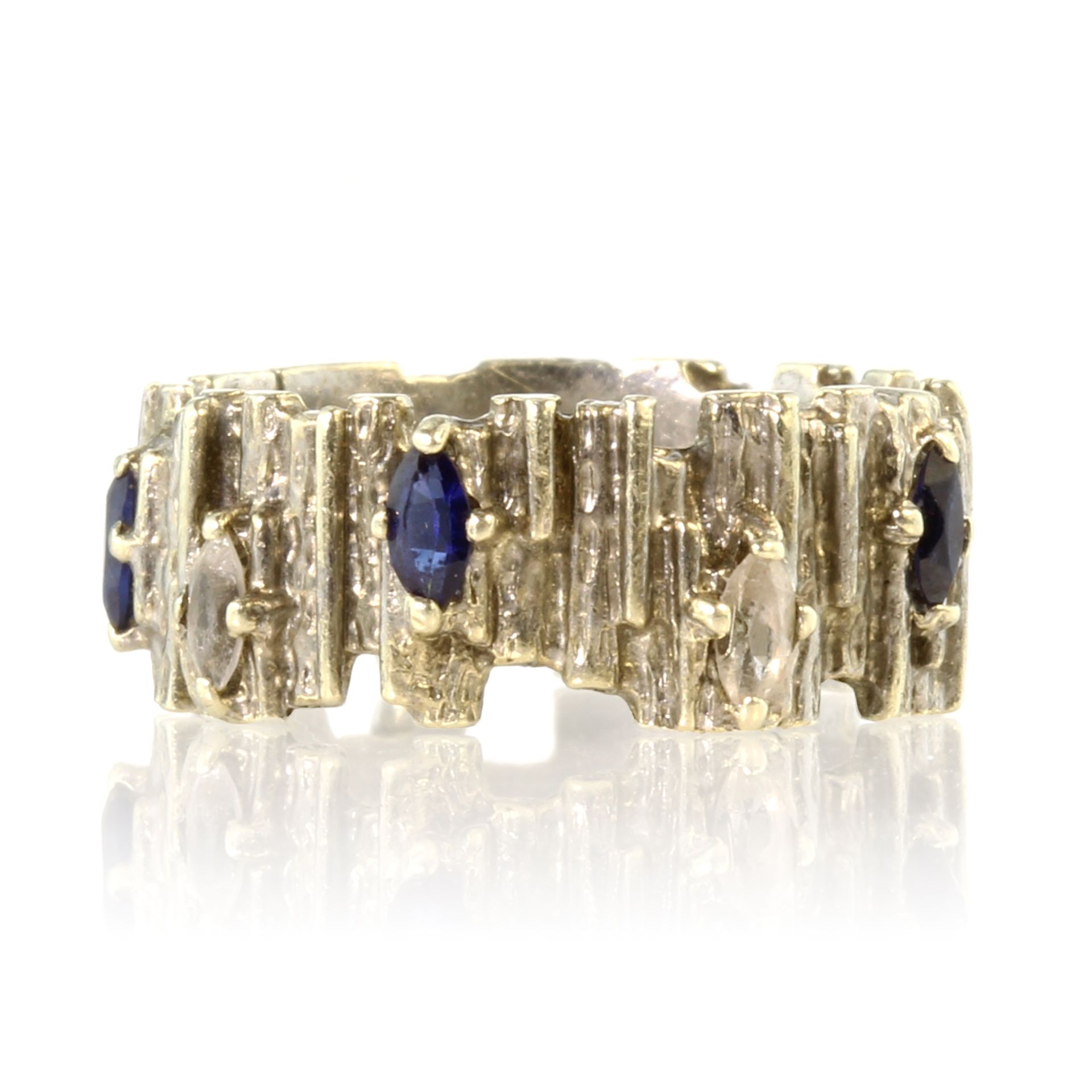 A vintage sapphire and diamond dress ring in 9ct white gold in the manner of Charles de Temple the
