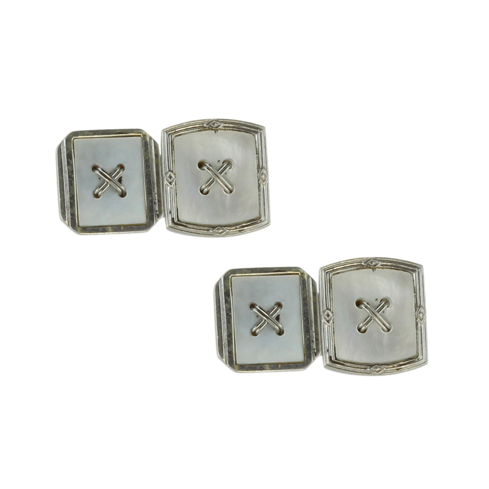 A pair of vintage mother of pearl cufflinks in 18ct white gold each designed as two links with