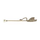 An antique pearl, ruby and diamond swan jabot pin in high carat yellow gold designed with a jewelled