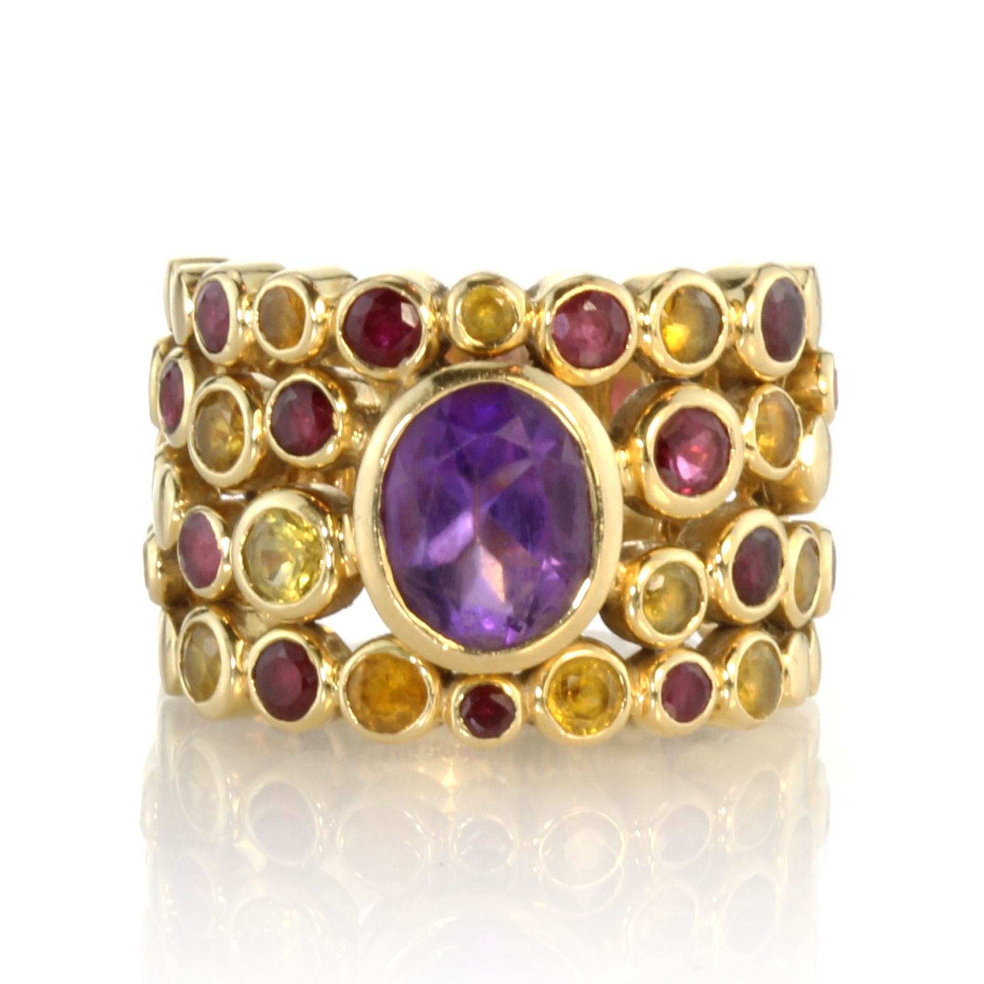 FRED An amethyst, garnet and citrine dress ring in 18ct yellow gold by Fred Paris set with a central