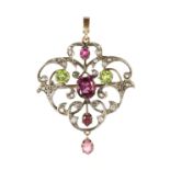 An antique Victorian garnet, peridot and diamond pendant in yellow gold designed as a belle epoque