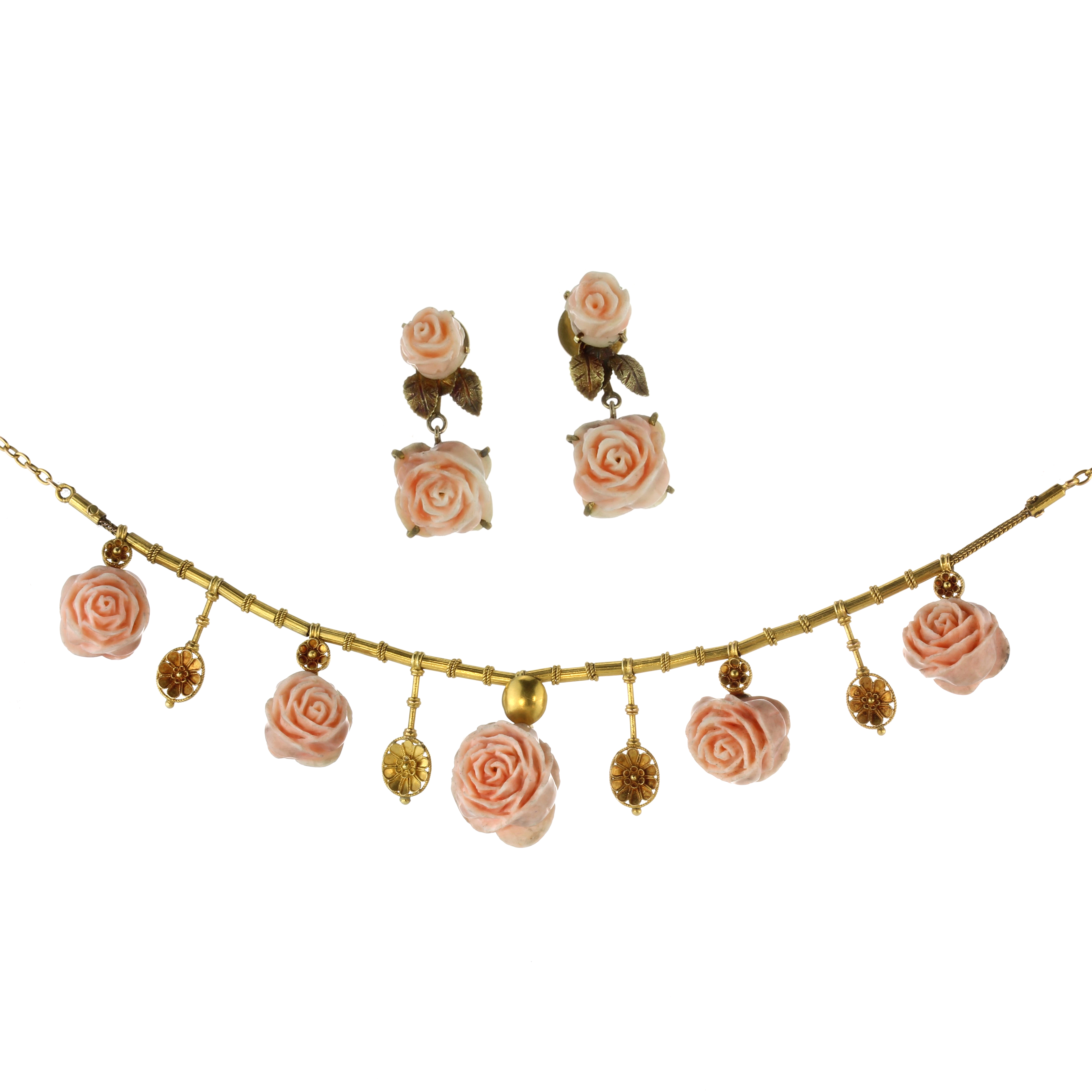 An antique coral rose necklace and earrings suite the necklace set with five graduated carved