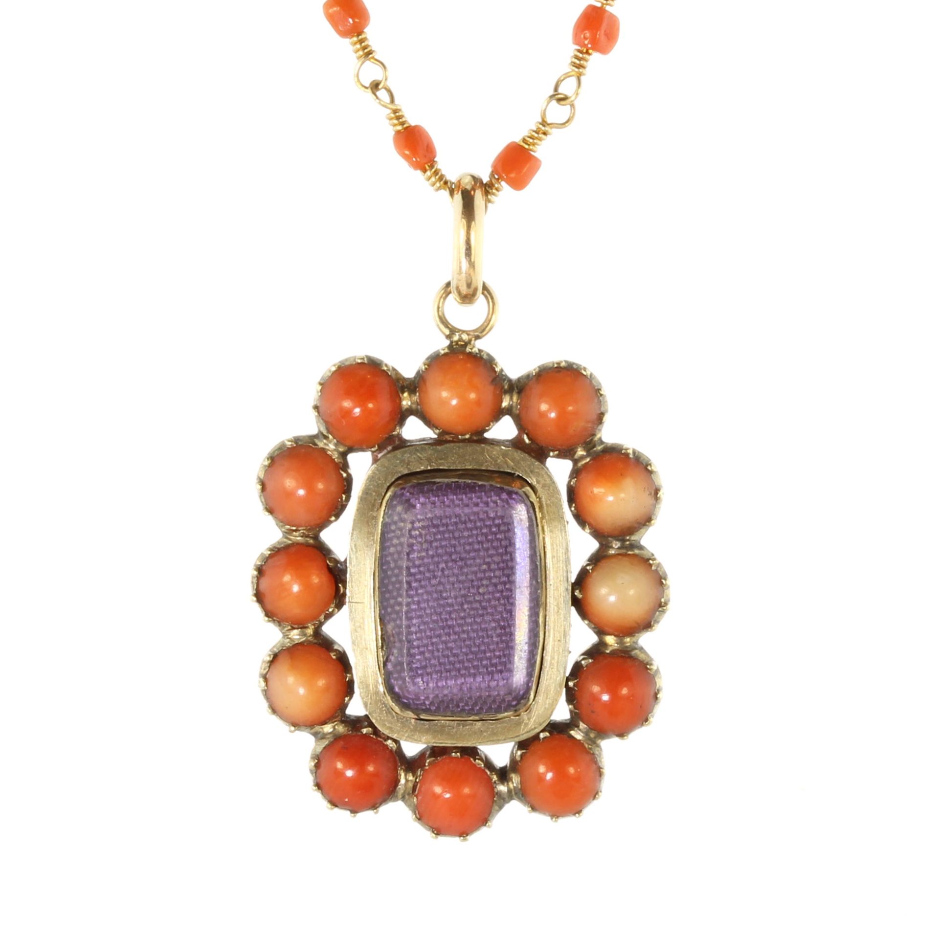 An antique Georgian coral bead mourning brooch and chain in high carat yellow gold, designed as a