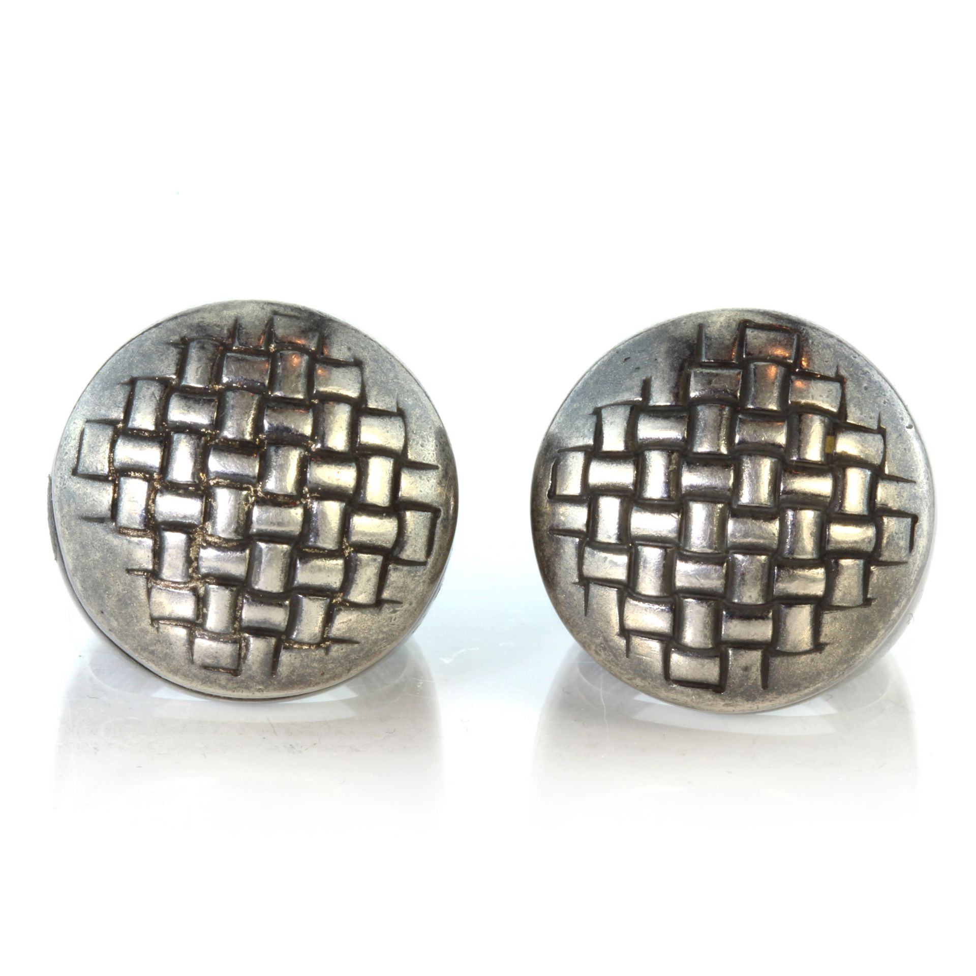 A pair of vintage Italian sterling silver cocktail rings each designed as a large bombe body with