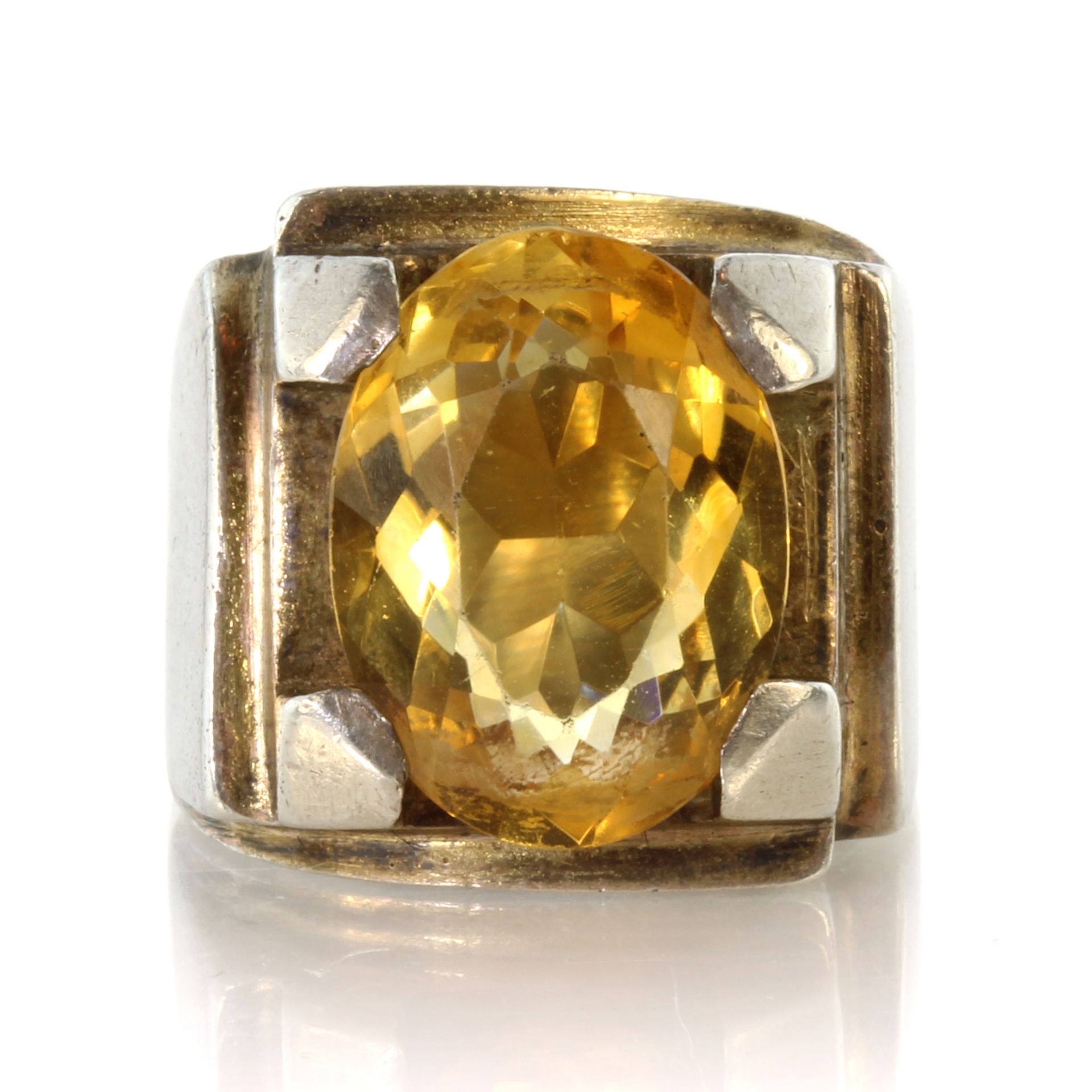 A vintage French citrine dress ring in silver designed as a large oval cut citrine of