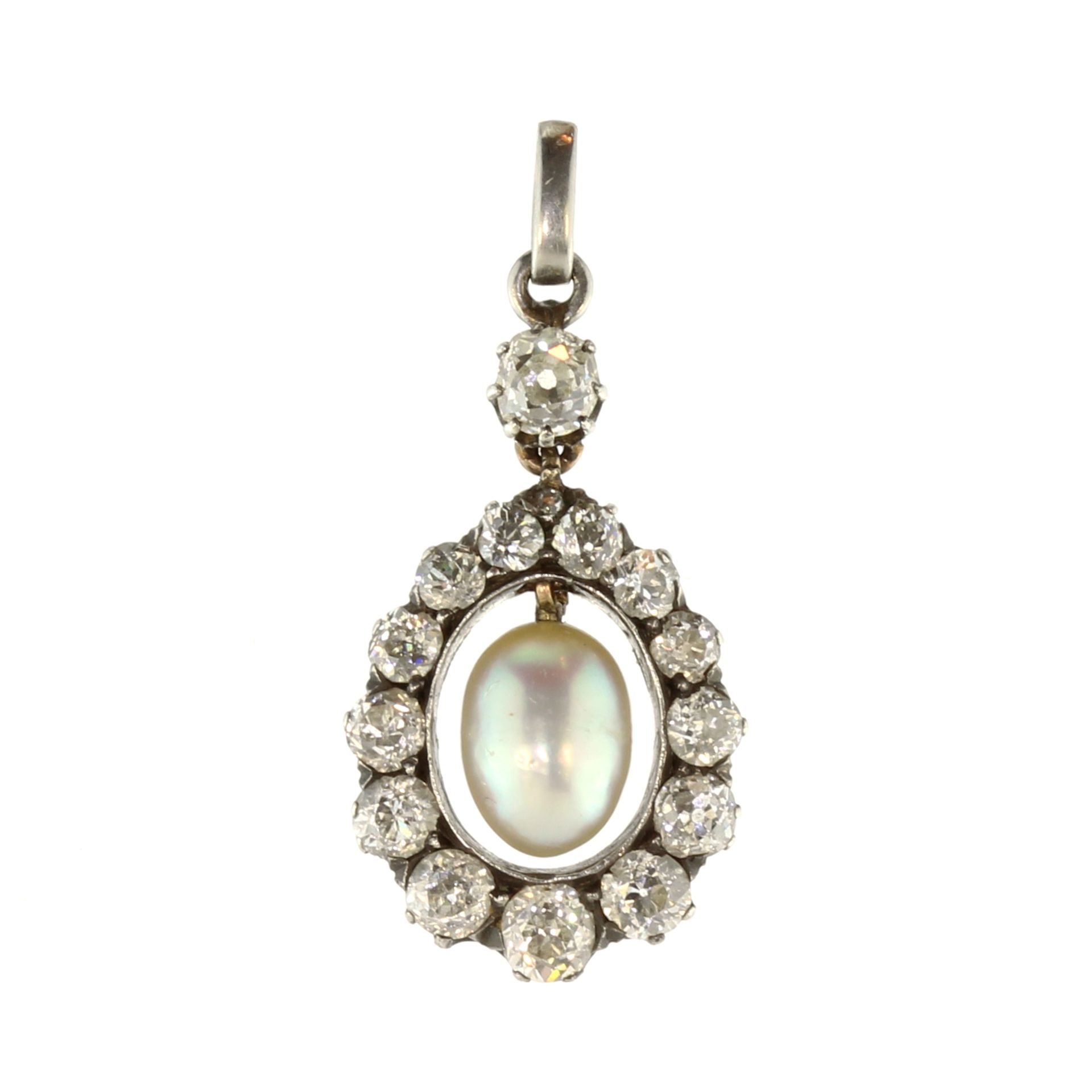 An antique natural saltwater pearl and diamond pendant in gold and silver, set with a central