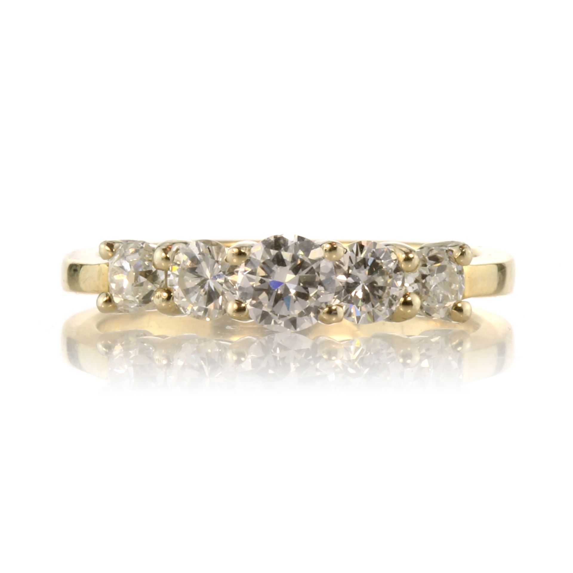 A diamond five stone dress ring in 18ct yellow gold set with five graduated round cut diamonds