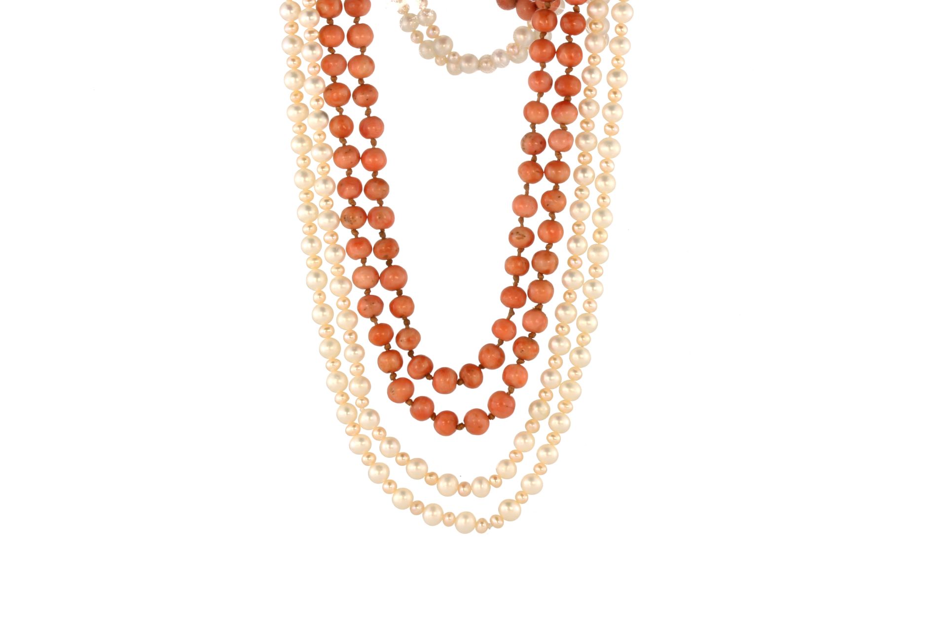 An antique coral bead necklace designed as a long single strand of 170 coral beads of