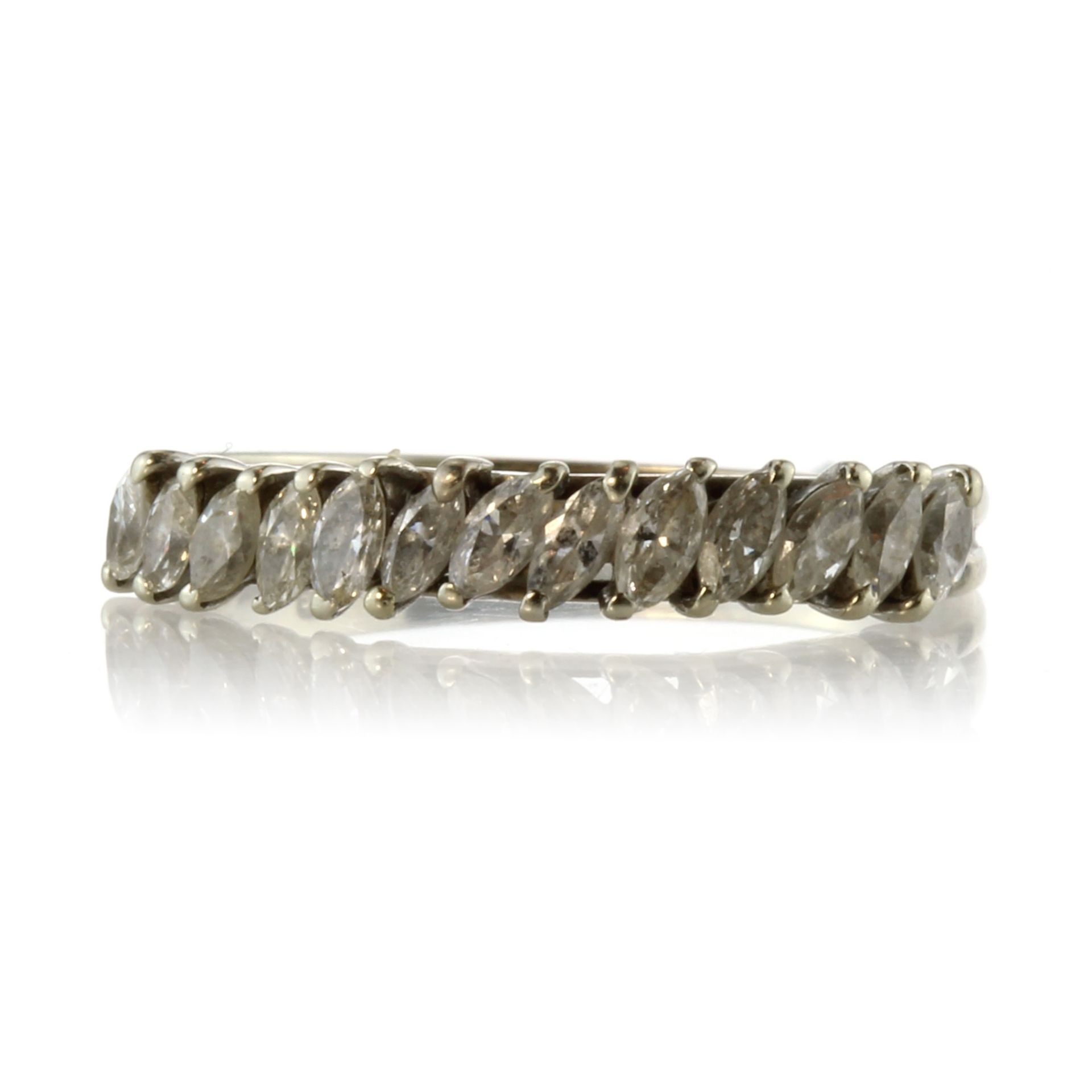 A diamond half eternity ring in 18ct white gold set with thirteen marquise cut diamonds totalling