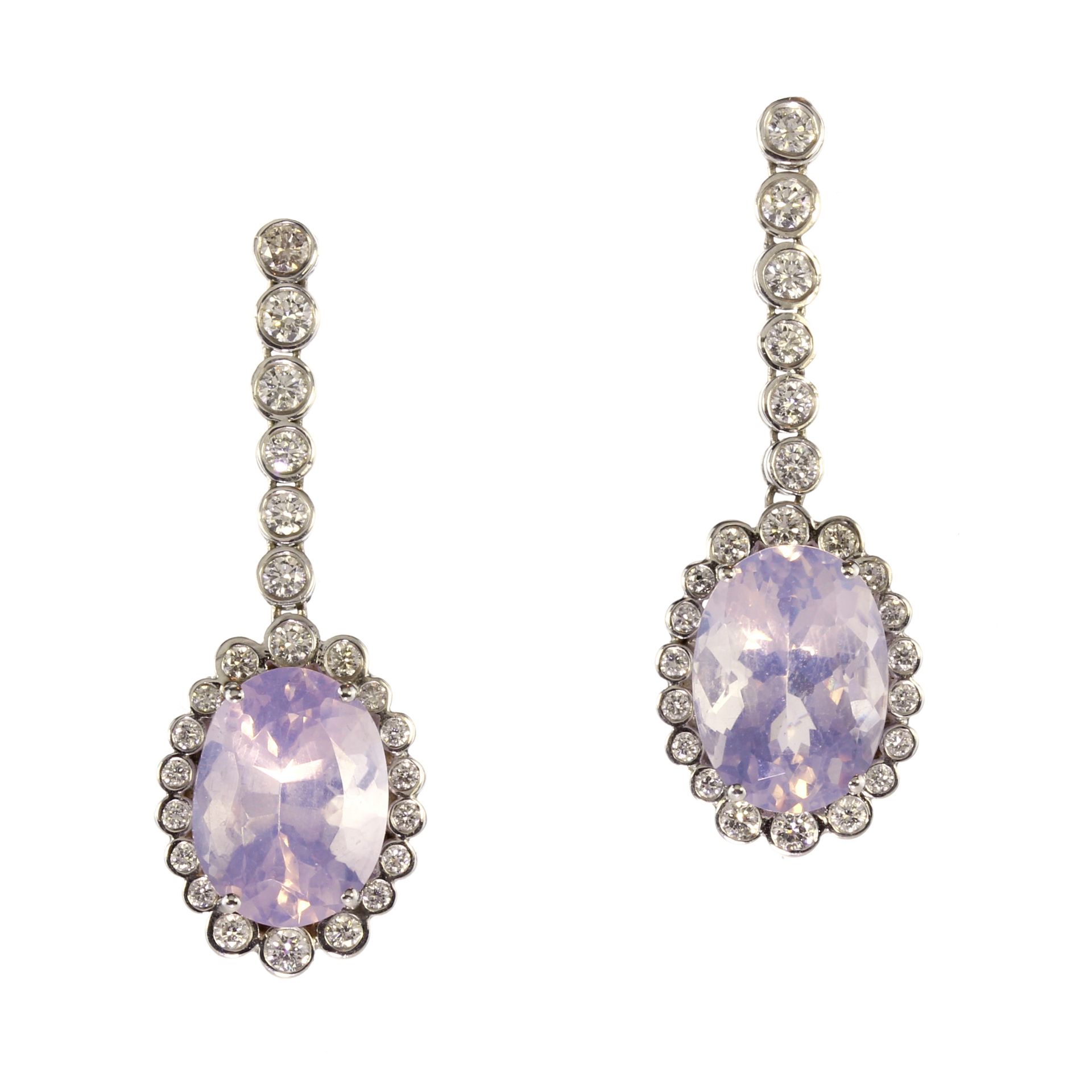 A pair of lavender amethyst and diamond earrings in 18ct white gold each set with a central oval cut
