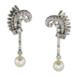 A pair of French diamond and pearl cocktail earrings in platinum each designed as a scrolling