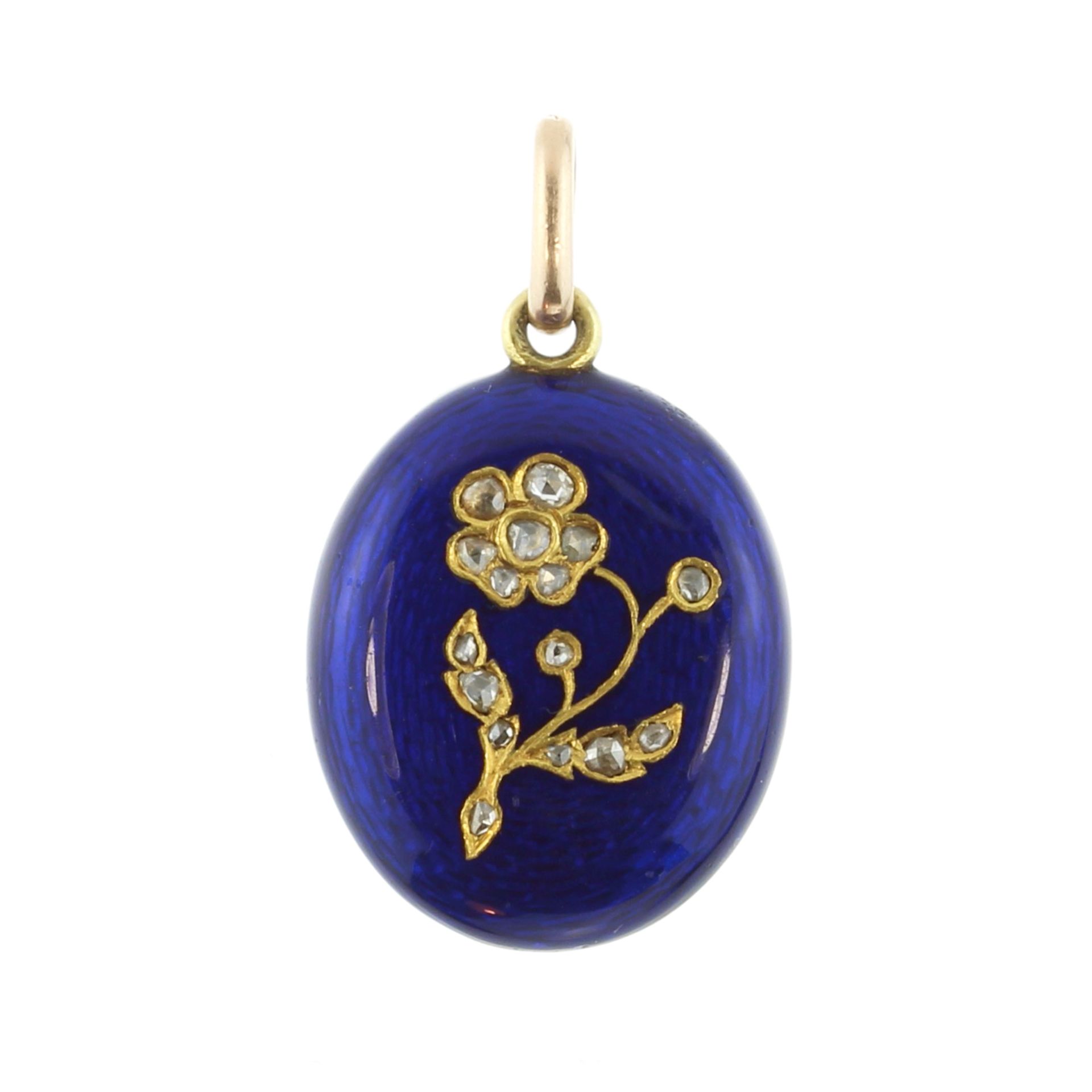 An antique Victorian diamond and enamel forget-me-not mourning pendant in high carat yellow gold