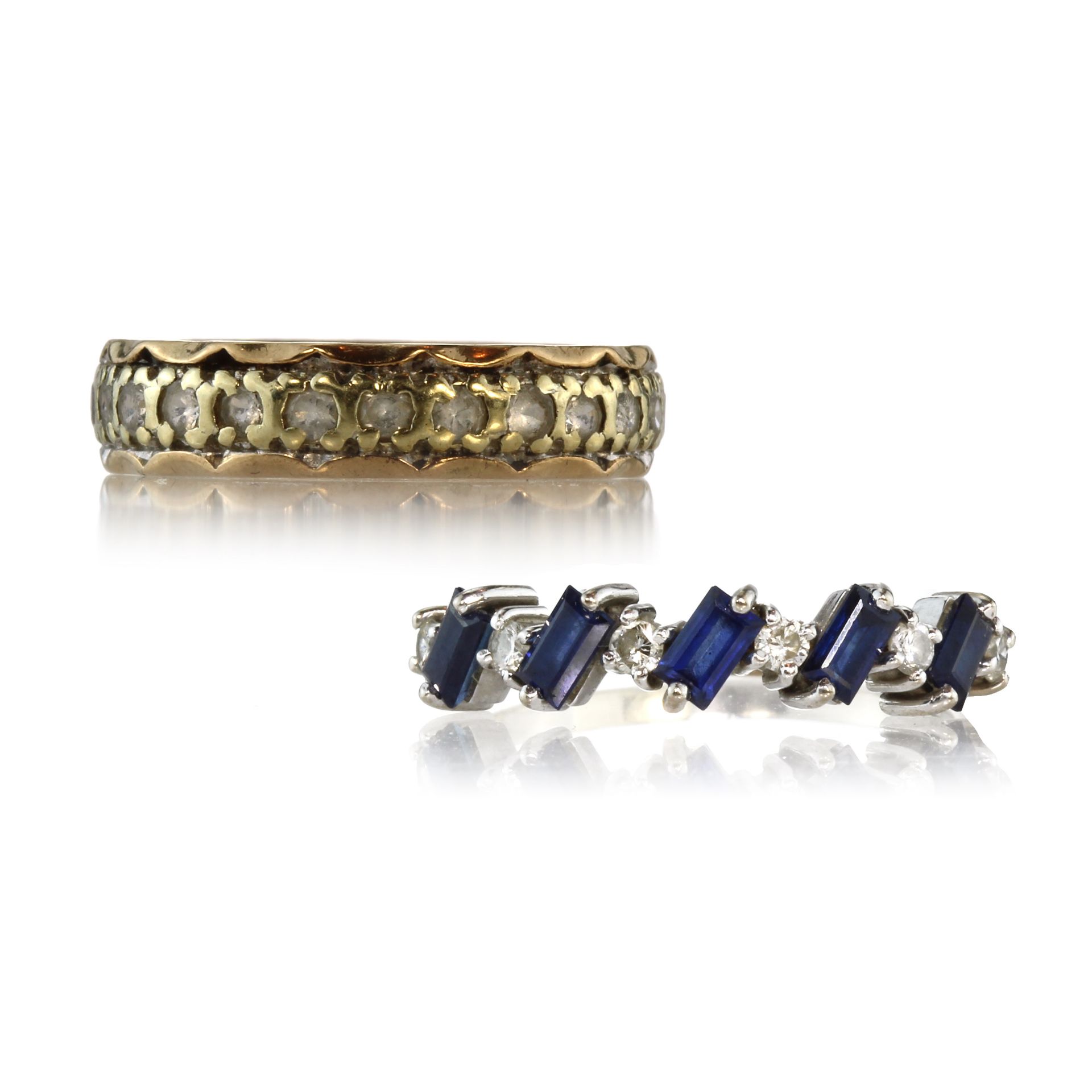 A sapphire and diamond dress ring in 18ct white gold set with a single row of alternating round