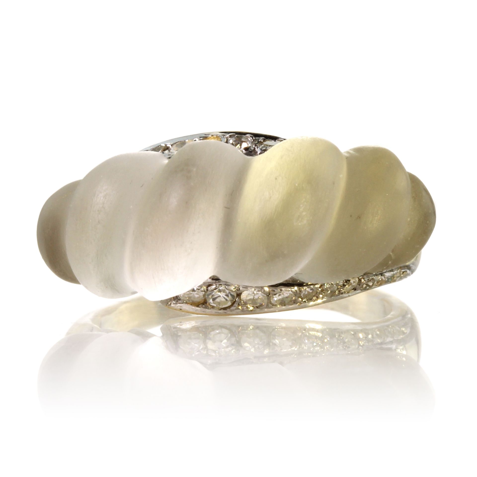 A vintage rock crystal and diamond dress ring in high carat yellow gold of bombe form, the the