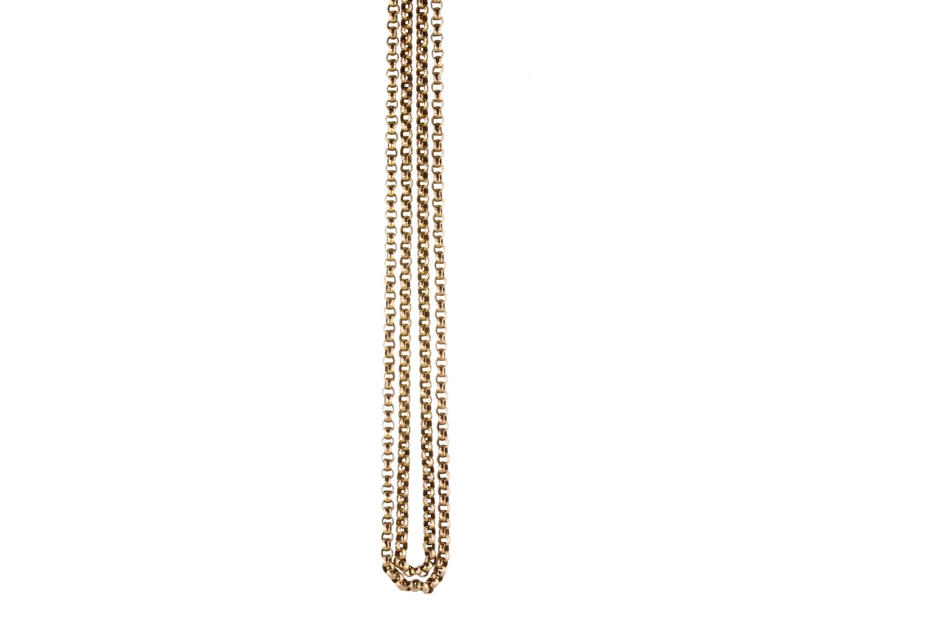 An antique long guard chain in yellow gold designed as a long, rounded belcher link chain with